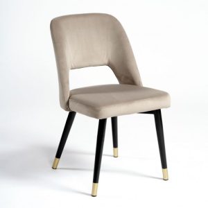 Silla de terciopelo beige con agujero y pata metal negro y tapón dorado Silla de terciopelo beige con agujero y pata metal negro y tapón dorado