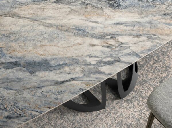 Mesa comedor ovalada barril mármol porcelánico y acero negro